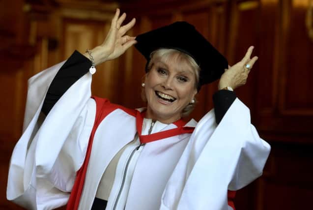 Broadcaster Angela Rippon is awarded an honorary doctor of civil law degree at Newcastle University. PRESS ASSOCIATION Photo. Picture date: Wednesday December 3, 2014. In recent years she has become an ambassador for the Alzheimer's Society and co-chairs the Prime Minister's Dementia Friendly Communities Champions Group.
