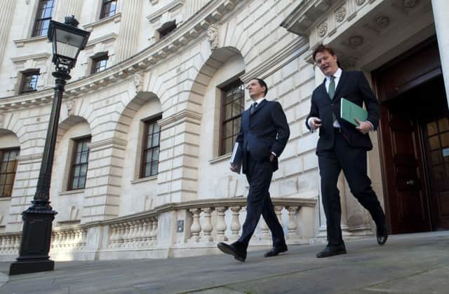Chancellor George Osborne (left) and Treasury Chief Secretary Danny Alexander leave the Treasury in London