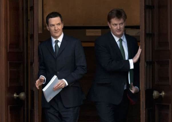 Chancellor George Osborne and Treasury Chief Secretary Danny Alexander leave the Treasury