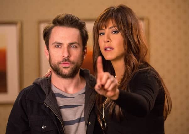 Charlie Day and Jennifer Anniston in Horrible Bosses 2