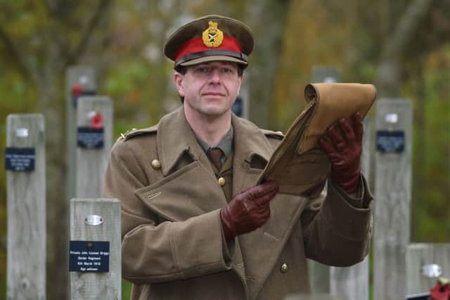 First World War reenactor Paul Thompson at the National Memorial Arboretum in Staffordshire reads a letter written by General Walter Congreve VC about the Christmas Truce of 1914. Photo: Joe Giddens/PA Wire