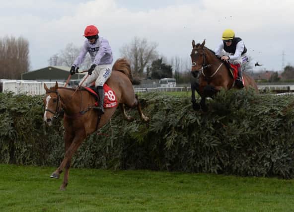 Chance Du Roy and Tom O Brien jump the final fence of the Grand National Course ahead of Baby Run and Sam Twiston Davies  as they go on and win the  Betfred Becher Chase during the Becher Chase Day at Aintree last year.