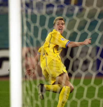 Alan Smith turns to celebrate his goal against Lazio at the Olympic stadium in 2000.