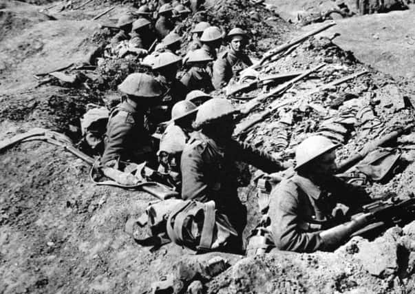 British infantrymen occupying a shallow trench before an advance during the Battle of the Somme.