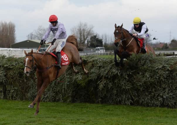 REPEAT SHOW: Chance Du Roy and Tom O Brien jump the final fence of the Grand National Course ahead of Baby Run and Sam Twiston-Davies as they go on and win the  Betfred Becher Chase during the Becher Chase Day at Aintree. last year. Pictures: John Giles/PA.
