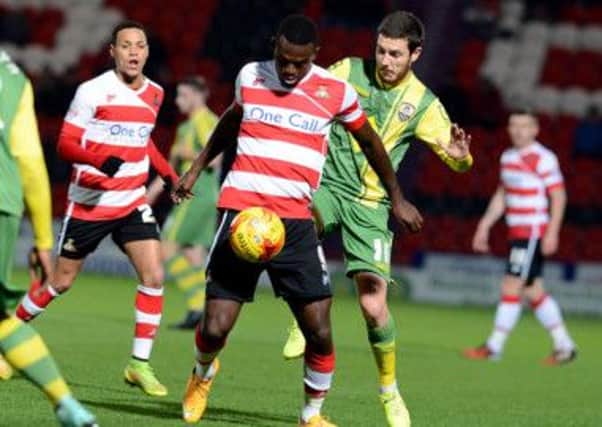 Doncaster Rovers' Theo Robinson in action against Notts County.