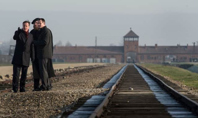Prime Minister David Cameron is shown the Birkenau extermination camp in Poland.
