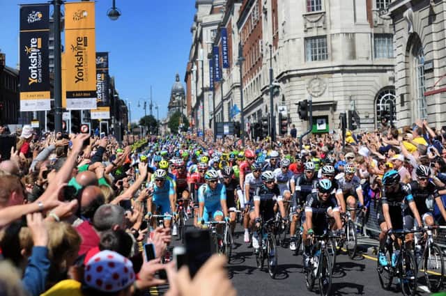 Mark Cavendish leads the cyclists down the Headrow at the Start of the Tour De France 6th July 2014 Picture by Simon Hulme