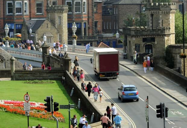 August 2013: Traffic still crossing  Lendal Bridge in York  after it was closed the previous day