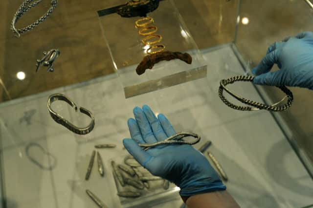 Natalie McCaul, curator of archaeology at the Yorkshire Museum in York with an Anglo Saxon gold and iron Pommel