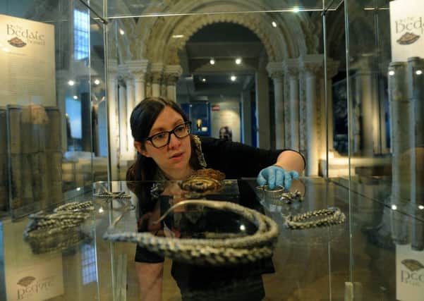 Natalie McCaul, curator of archaeology at the Yorkshire Museum in York with an Anglo Saxon gold and iron Pommel
