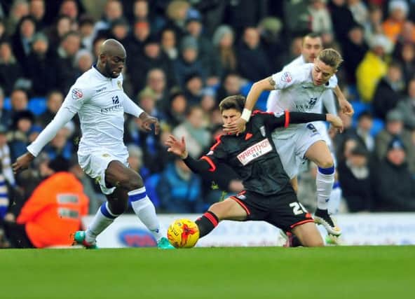 Leeds' Adryan gives one in the face for Fulham's Emerson Hyndman as Souleymane Doukara pinches the ball. Picture by Tony Johnson