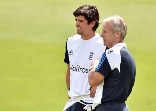 England coach Peter Moores (left) and captain Alastair Cook (right).