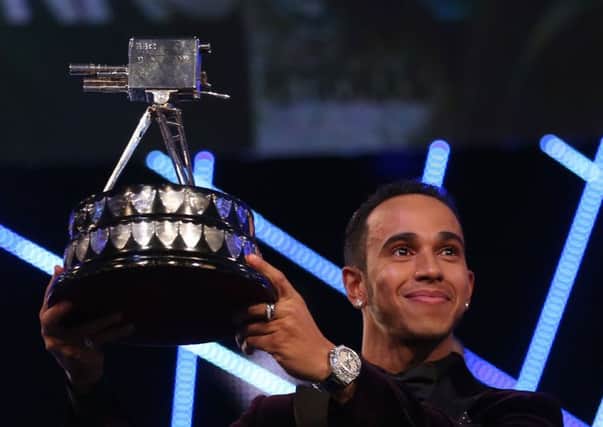 Winner of Sports Personality of the Year 2014, Lewis Hamilton during the 2014 Sports Personality of the Year Awards at the SSE Hydro, Glasgow. PRESS ASSOCIATION Photo. Picture date: Sunday December 14, 2014. See PA story SPORT Personality. Photo credit should read: David Davies/PA Wire