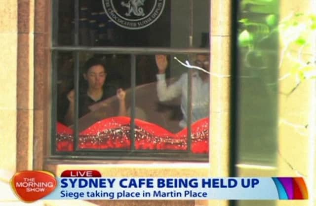 The scene at the cafe under siege at Martin Place in Sydney