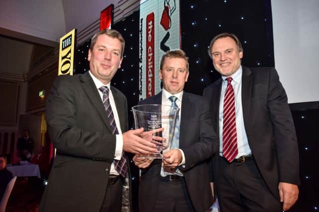 (L-R) Econ's Andrew and Jonathan Lupton, Yorkshire Bank chairman Richard Gregory