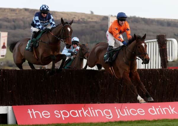 Kings Palace (right) ridden by Tom Scudamore on their way to victory in the Ryman Stationery Cheltenham Business Club Novices´ Chase last Friday. Picture: David Davies/PA.