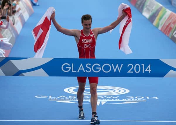 England's Alistair Brownlee crosses the line after winning the Mixed Team Relay at Strathclyde Country Park during the 2014 Commonwealth Games near Glasgow.