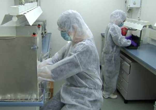 Researchers working in the ancient DNA lab at the University of York. (Photo credit: Carl Vivian Leicester University).