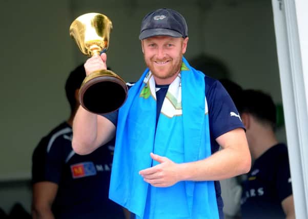 Yorkshire captain Andrew Gale lifts the championship trophy. 12th September 2014. Picture: Jonathan Gawthorpe.