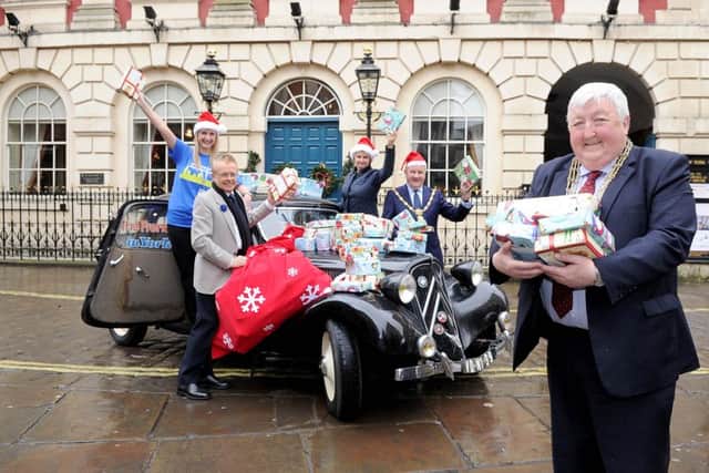 GENEROSITY RECREATED: Nicola Taylor of York Teaching Hospital Charity, Ian Reed, director of the Yorkshire Air Museum, Alison Wragg of Martin House Hospice, Sheriff of York John Kenny, and the Lord Mayor of York Coun Ian Gillies. Picture: James Hardisty
