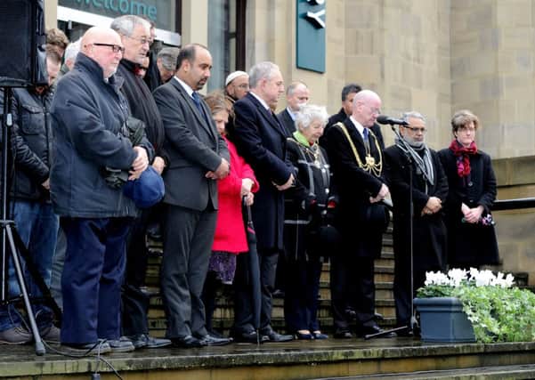 The Lord Mayor of Leeds, Councillor David Congreve leads a minute's silence outside Leeds Art Galley in memory of the victims of Pakistan Taliban massacre