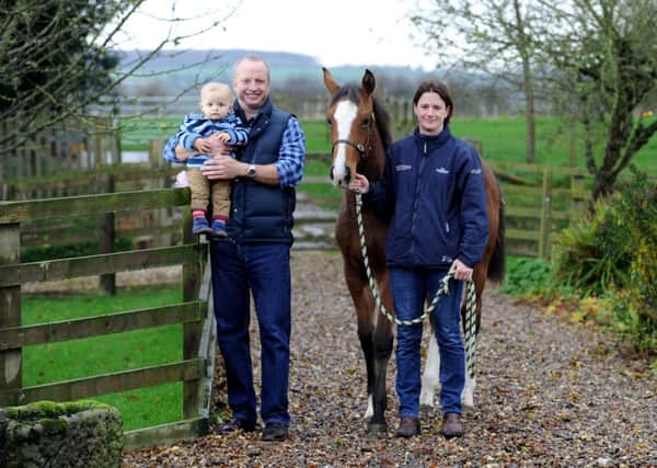 Horse breeder Kate Betteridge of Shiptonthorpe, near York, with husband Tim, baby boy Oliver, aged 15 months, and their award-winning foal Jorvik Star. Picture: James Hardisty.