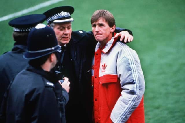 Mandatory Credit: Photo by Colorsport/REX (3036328a)
Kenny Dalglish (Liverpool Manager) shows his concern as Policemen console him Hillsborough disaster Liverpool v Nottingham Forest FA Cup Semi Final 15/4/89 Great Britain Sheffield FA Cup SF: Liverpool v N Forest - Abandoned
Sport