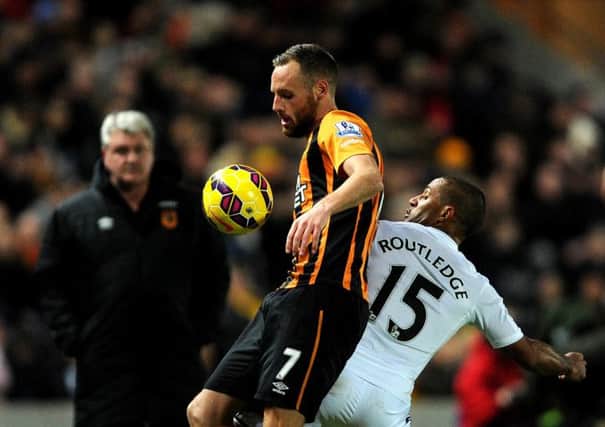 Hull City's David Meyler duels with Swansea City's Wayne Routledge (Picture: Anna Gowthorpe/PA Wire).