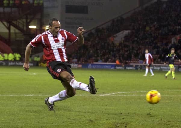 Sheffield United's Chris O'Grady scores against Walsall. Picture: Martyn Harrison.