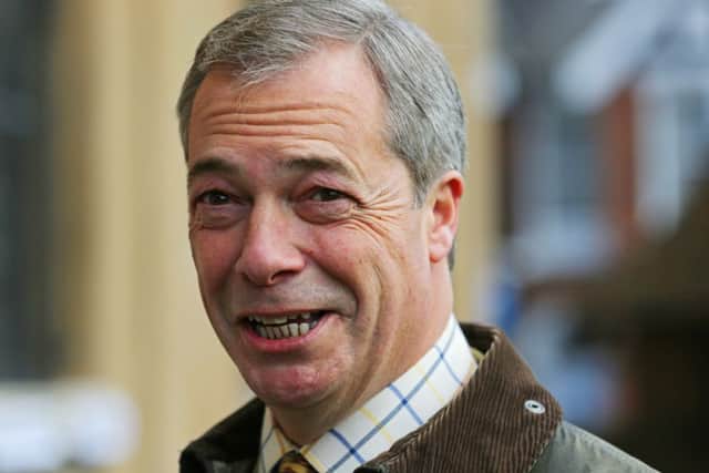 UKIP Leader Nigel Farage has criticised a phone app featuring a character called Nicholas Fromage kicking immigrants off the White Cliffs of Dover.