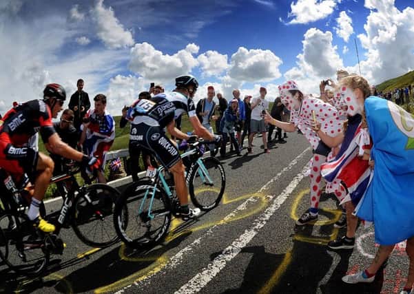 Fans cheer on cyclists as they tackle the Holme Moss climb on the Tour de France. (Picture: Simon Hulme)