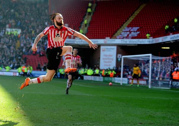 Sheffield United's John Brayford, leaps into the air to celebrate scoring the second goal against Charlton in the FA Cup quarter-final. (Picture: James Hardisty).