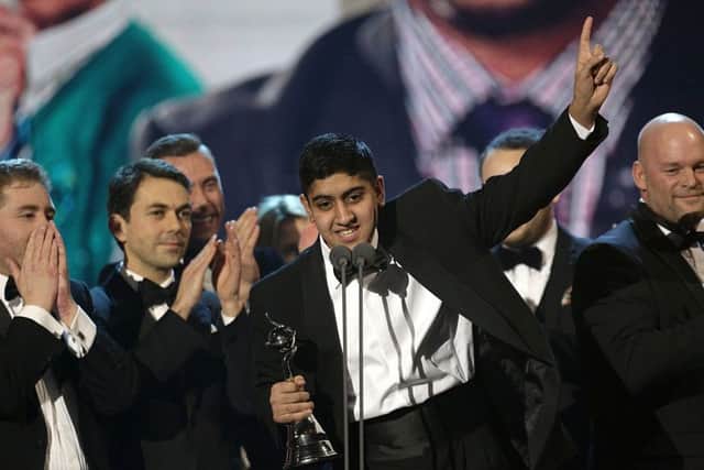Musharaf Asghar accepts the award for Best Documentary for Educating Yorkshire during the 2014 National Television Awards
