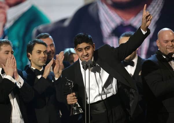 Musharaf Asghar accepts the award for Best Documentary for Educating Yorkshire during the 2014 National Television Awards