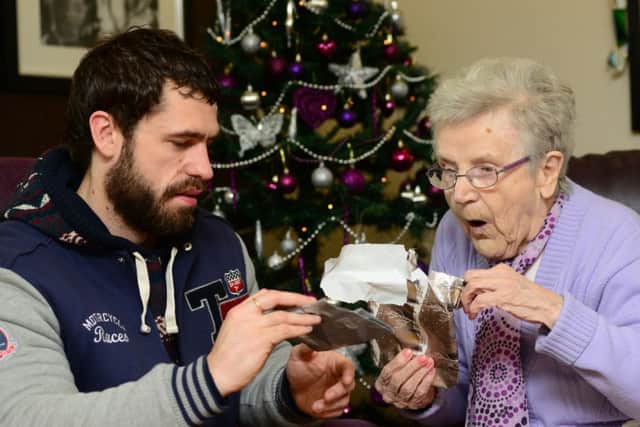 Emmerdale actor Kelvin Fletcher delivering presents to Mary Cafferty at Ashworth Grange Care Home in Dewsbury, as part of the Gift for Granny project.
Picture: Scott Merrylees