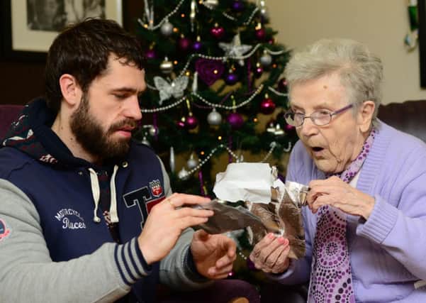 Emmerdale actor Kelvin Fletcher delivering presents to Mary Cafferty at Ashworth Grange Care Home in Dewsbury, as part of the Gift for Granny project.
Picture: Scott Merrylees