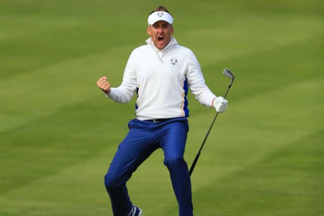 Europe's Ian Poulter celebrates chipping in from off the green during day two of the 40th Ryder Cup.
