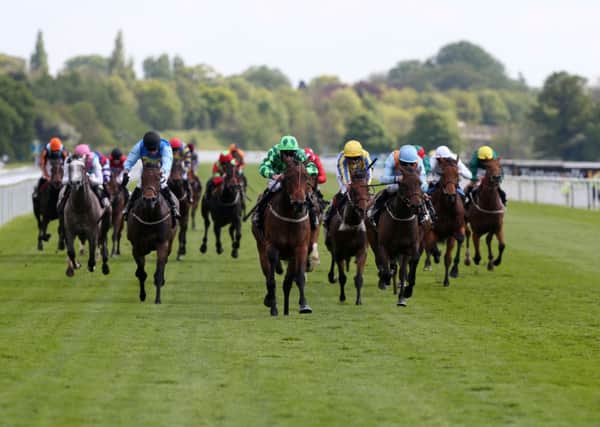 Daniel Tudhope (centre in green) wins The Conundrum HR Consulting Stakes on That Is The Spirit during day one of the Dante Festival at York Racecourse