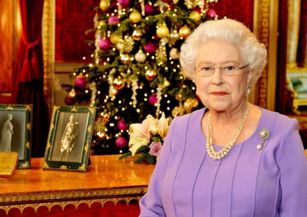 Britain's Queen Elizabeth II stands in the State Dining Room of Buckingham Palace, London, after recording her Christmas Day television broadcast to the Commonwealth. PRESS ASSOCIATION Photo. Picture date: Thursday December 25, 2014. See PA story ROYAL Queen. Photo credit should read: John Stillwell/PA Wire
