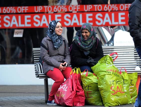 Shoppers with their bargins in the Boxing Day sales on Briggate in Leeds.
26th December 2014.
Picture : Jonathan Gawthorpe