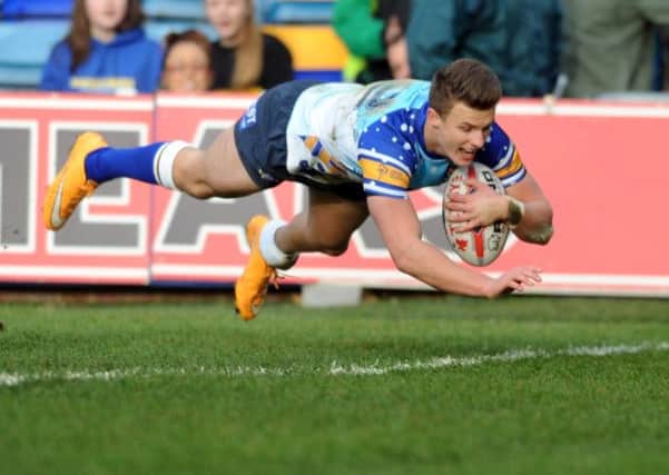BRIGHT FUTURE: Leeds Rhinos' Ash Handley scores his third try against Wakefield at Headingley. Picture: Steve Riding.