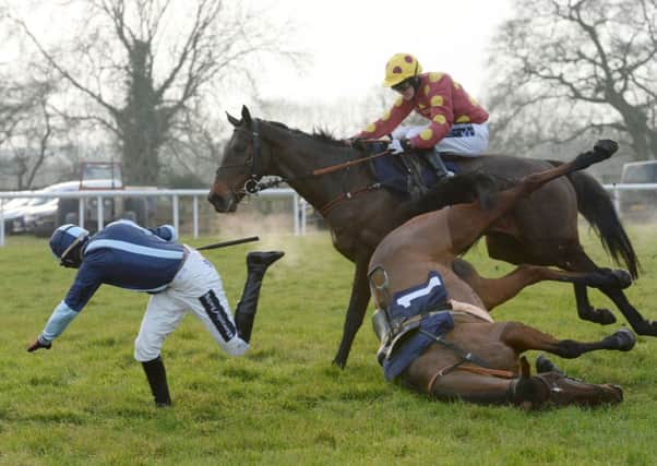 Itstimeforapint ridden by Craig Nichol passes jockey Conor O'Farrell after he fell from No Through Road on their way to winning the William Hill Download The App Novices' Handicap at Wetherby. Picture: Anna Gowthorpe/PA.