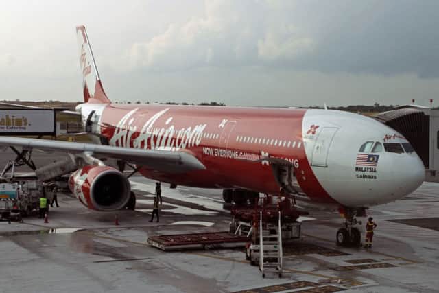 An AirAsia X Airbus A330-300 passenger jet is parked on the tarmac at low cost terminal KLIA2 in Sepang, Malaysia.