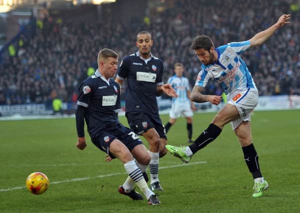 Jacob Butterfield of Huddersfield Town shoots for goal against Bolton Wanderers