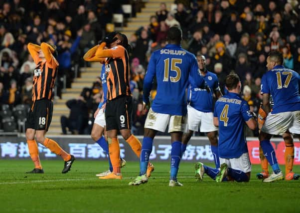 Hull City's Nikica Jelavic and Abel Hernandez react after a missed chance during the Barclays Premier League match at the KC Stadium, Hull.
