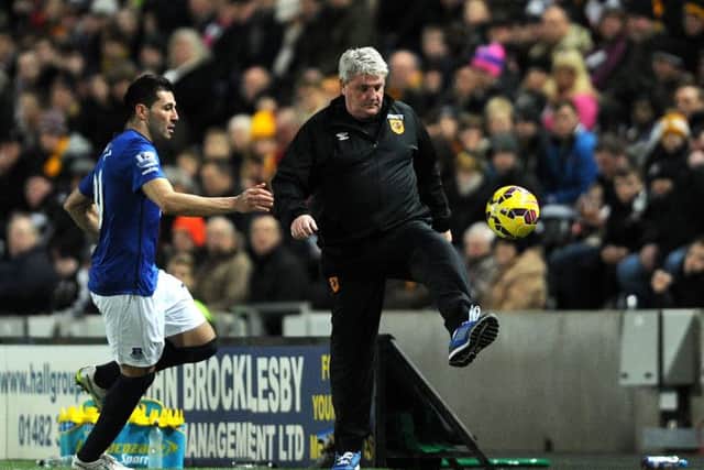 Hull City manager Steve Bruce brings the ball under control on the sidelines against Everton yesterday. Picture: Anna Gowthorpe/PA.
