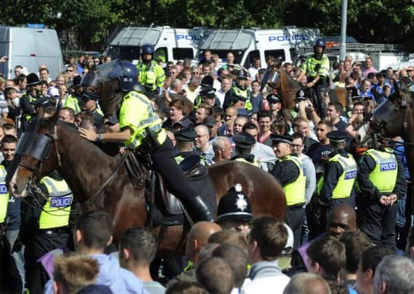 Leeds United v Millwall, 2010: Police escort the Millwall fans into the ground. Picture By Simon Hulme