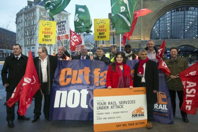 Train fare rises saw campaigners from the RMT protest outside of Kings Cross station in London.