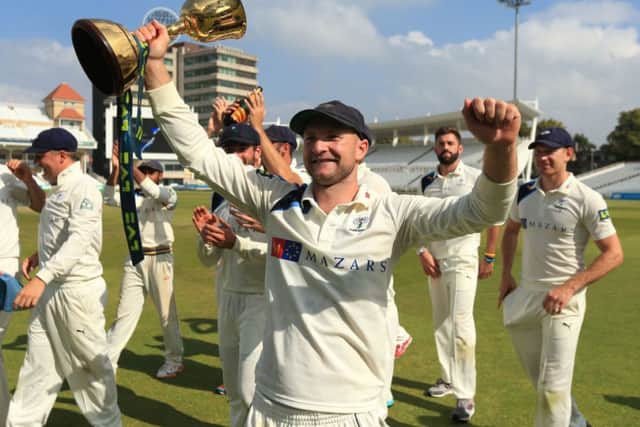 Yorkshire's Adam Lyth celebrates winning the Division One County Championship trophy during day four of the LV= County Championship Division One match at Trent Bridge, Nottingham.